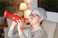 Senior woman playing a trumpet Royalty Free Stock Photo