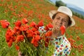 Senior woman on poppy field Royalty Free Stock Photo