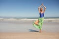 Senior woman practising yoga while standing against clear sky Royalty Free Stock Photo