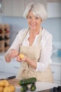 senior woman preparing meal in kitchen Royalty Free Stock Photo