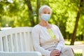 Senior woman in protective medical mask at park Royalty Free Stock Photo