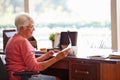 Senior Woman Putting Letter Into Keepsake Box Royalty Free Stock Photo