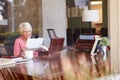 Senior Woman Putting Letter Into Keepsake Box Royalty Free Stock Photo