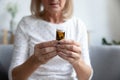 Senior woman reading medicine prescription label, close up view Royalty Free Stock Photo