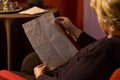 Senior woman reading yellowed letter