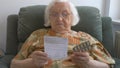 Senior woman reads a medicine information Royalty Free Stock Photo