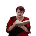 Senior woman reads thriller Royalty Free Stock Photo