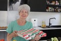 Senior woman receiving pizza delivery Royalty Free Stock Photo