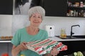 Senior woman receiving pizza delivery Royalty Free Stock Photo