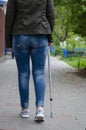 Senior woman on a rehabilitation after surgery or on recovery walks with walking cane Royalty Free Stock Photo