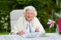 Senior woman relaxing in the garden Royalty Free Stock Photo
