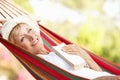 Senior Woman Relaxing In Hammock Royalty Free Stock Photo