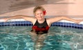 Senior woman relaxing in the pool Royalty Free Stock Photo