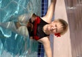 Senior woman relaxing in the pool Royalty Free Stock Photo