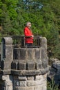 Senior woman is relaxing at viewpoint at Elbe Sandstone Royalty Free Stock Photo