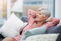 Senior woman, relief and relax on sofa in home living room with peace, silence and happiness with free time. Elderly Royalty Free Stock Photo