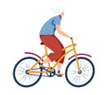 Senior woman riding a bicycle, active elderly female cyclist. Healthy lifestyle and aging gracefully, exercise for Royalty Free Stock Photo