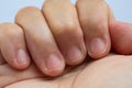 Senior woman right hand in fist with twisted nail in white background, Asian body skin part, Symbol, Gesturing, Body Language