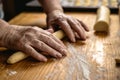 Senior woman is rolling pastry dough by hand. Royalty Free Stock Photo