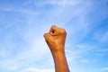 Senior woman`s hand in fist on blue sky background, Asian body skin part, Symbol, Gesturing, Body Language Concept Royalty Free Stock Photo