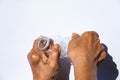 Senior woman hands squashing used plastic bottle, Water drops on transparent soft drink, White background, Global warming, Recycle Royalty Free Stock Photo