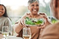 Senior woman, salad and family dinner at thanksgiving celebration at home. Food, elderly female person and eating at a Royalty Free Stock Photo