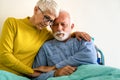 Senior woman with seriously ill husband in hospital. Healthcare support anxiety love concept Royalty Free Stock Photo