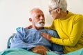 Senior woman with seriously ill husband in hospital. Healthcare support anxiety love concept Royalty Free Stock Photo