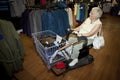 Senior woman shopping with a buggy Royalty Free Stock Photo