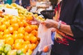 Senior woman shopping oranges at grocery store. Royalty Free Stock Photo