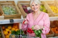 Woman shopping in small grocery store Royalty Free Stock Photo
