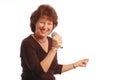 senior woman singing Microphone in hand Royalty Free Stock Photo