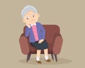 Senior woman sitting alone on sofa