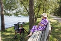 Senior woman sitting on a park bench