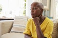 Senior Woman Sitting On Sofa At Home Suffering From Depression Royalty Free Stock Photo