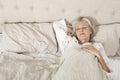 Senior woman sleeping in bed Royalty Free Stock Photo