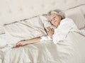 Senior woman sleeping in bed Royalty Free Stock Photo