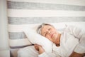 Senior woman sleeping on bed Royalty Free Stock Photo