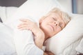 Senior woman sleeping on bed Royalty Free Stock Photo