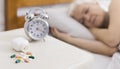 Senior woman sleeping in bed with help of pills Royalty Free Stock Photo