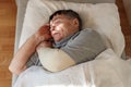 Senior woman sleeping on her bed. Relaxation concept, National napping day. Close up, selective focus Royalty Free Stock Photo