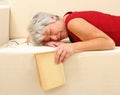 Senior woman sleeping on sofa Royalty Free Stock Photo