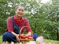 Senior woman smile portrait and holding red apple in garden park. Royalty Free Stock Photo