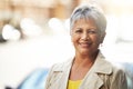 Senior woman, smile and portrait in outdoor for fashion, style and relax for retired and elderly in urban. Happy person Royalty Free Stock Photo
