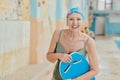 Senior woman, smile and swimming lesson, pool and workout, sport and training with happiness indoor. Portrait, happy or Royalty Free Stock Photo
