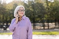 senior woman smiling happy talking by mobile phone Royalty Free Stock Photo