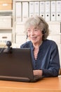 Senior woman smiling at webcam Royalty Free Stock Photo