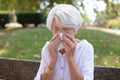 senior woman sneezing because pollen Royalty Free Stock Photo