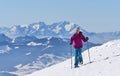 Senior woman snowshoeing in the Allgaeu Alps, Germany