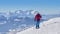 Senior woman snowshoeing in the Allgaeu Alps, Germany